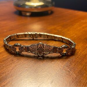 1930s white gold filigree bracelet with bits of emerald stone